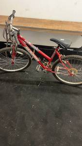 lot 83 image: Red Magna Mountain Bike with 18 Speed Shimano System