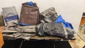 lot 101 image: Collection of Various Heavy-Duty Tarps in Multiple Colors