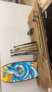 lot 122 image: Collection of Sports Equipment Bodyboards, Snowboard, Baseball Bats, and Hockey Sticks