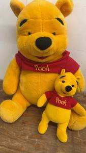 lot 125 image: Pair of Winnie the Pooh Teddy Bears - Large and Small Plush Toys