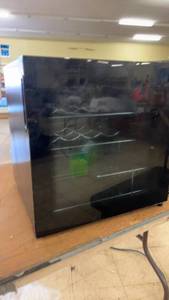 lot 205 image: Insignia Wine Cooler and 7 14 inch Circular Saw with Laser Line Guide
