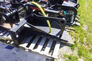 lot 17 image: Brand New Universal Mount Bobcat Skid Loader Skid Steer Stump Grapple Bucket
