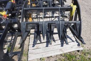 lot 23 image: Brand New Universal Mount Bobcat Skid Loader Skid Steer 48 Root Rake Grapple Bucket