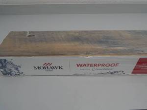 lot 13 image: Mohawk Luxury Vinyl Flooring - Color Woodmill Oak