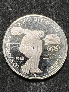lot 31 image: 1983-S US OLYMPIC COMMEM SILVER DOLLAR