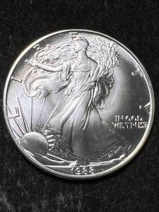 lot 50 image: 1988 AMERICAN SILVER EAGLE 1 TROY OZ .999 FINE SILVER