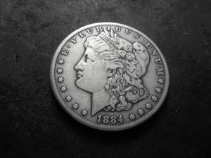 lot 27 image: 1884 CC Morgan Silver Dollar