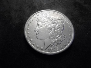 lot 32 image: 1885 O Morgan Silver Dollar