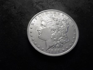 lot 34 image: 1886 Morgan Silver Dollar