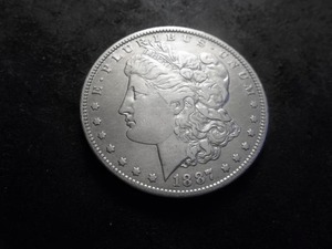 lot 38 image: 1887 O Morgan Silver Dollar