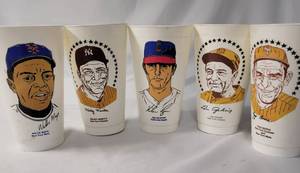 lot 33 image: 16 Vintage 7-Eleven Slurpee Hall of Fame Cups - includes names like Nolan Ryan, Micky Mantle, Lou Gehrig, Yogi Berra, Willie Mays and others.  Made in the 70s..  5 12 Tall