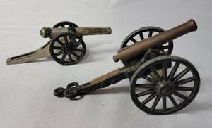 lot 38 image: 2-Vintage  Canons. 1 is a Vintage Mini Cast IronBrass Canon Replica Stones River Battlefield. 5 Long 3 inches wide and 2 12 inches tall. The other is a precast canon.  Made in the 60s.