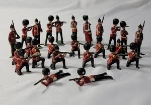 lot 42 image: 25-Vintage Red and Black Precast British Soldiers in battle. - Made by JOHILLCO in the 50s