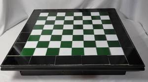 lot 50 image: 21 x 21  Checker boardChess set with green and white tiles. Board had pullout drawer that hold the included chess and checker pieces.