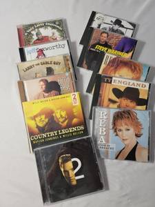 lot 54 image: 11 CDs (Elvis, , Ty England, Collin Raye, Larry the Cable Guy (2),Reba (2), Rick Trevino,Jeff Foxworthy, Steve Warniner, Waylon & Willie)