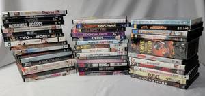 lot 55 image: Movie Night - 42 DVDs of Different Genres and Ratings.