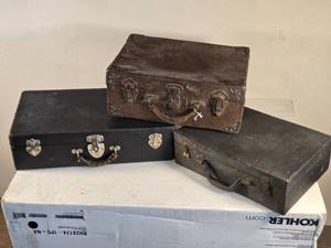 lot 144 image: Lot of 3 AntiqueVintage Suitcases including Leather-Trimmed Case, Black Case, and Fabric-Lined Case