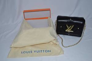 lot 10 image: Louis Vuitton Quilted Twist MM Bag