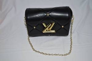 lot 10 image: Louis Vuitton Quilted Twist MM Bag