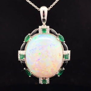 lot 35 image: Classy Oscar Friedman 32.27 Carat White Opal, Emerald & Natural Diamond Oval Halo Pendant in Platinum w Report $10,799 Retail