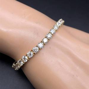 lot 4 image: Gorgeous 12.34 Carat Natural Diamond Tennis Bracelet in 14K Yellow Gold $34,000 Retail
