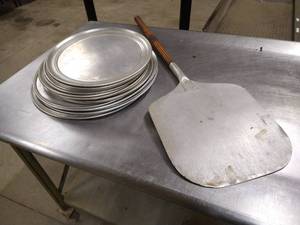 lot 58 image: Stack of Pizza Pans  Pizza Paddle