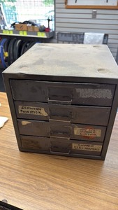 lot 642 image: Assorted Schwinn Twin Stick Shifter Parts in Storage Cabinet