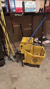 lot 355 image: Yellow Mop Bucket with Wringer and Set of Mops