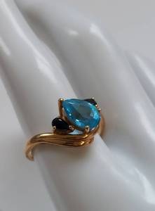 lot 22 image: Elegant 14k Gold Ring with Blue Topaz & Sapphire