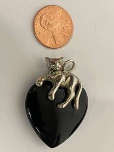 lot 34S image: Sterling Silver Cat Pendant on Black Heart Shape