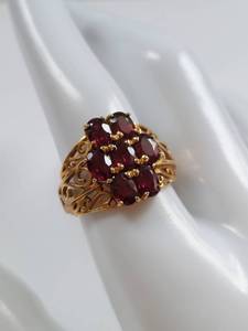 lot 58 image: 10K Gold Ring with Garnet Gemstones and Intricate Filigree