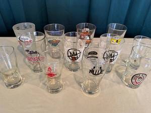 lot 46 image: Collection of 13 Assorted Brewery and Sports Logo Pint Glasses
