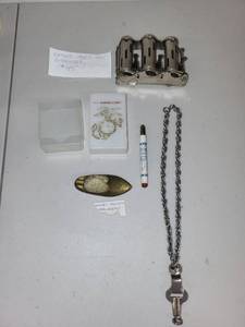 lot 75 image: Vintage 1940s Coin Dispenser, Brass Ashtray, U.S. Marine Corps Card Case, and Accessories