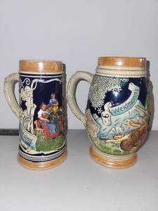 lot 32 image: Pair of Vintage German Beer Steins with Relief Scenes