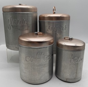 lot 18 image: Mid Century Spun Aluminum Heller Hostessware Canister Set 4 piece