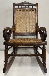 lot 30 image: Antique Childrens Walnut and Cane Lincoln Rocking Chair Boho