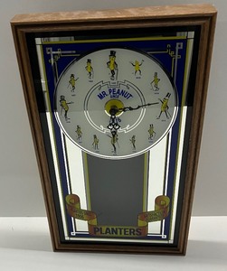 lot 77 image: Vintage 1992 Planters Mr. Peanut Evolution Clock.