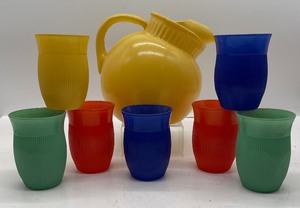 lot 192 image: Vintage Hazel Atlas Tilted Ball Pitcher and Flare Rim Ribbed Glasses (7)