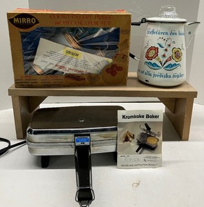 lot 80 image: Electric Krumkake Iron, Berggren Swedish Enamelware Coffee Pot, Mirro Pastry Press