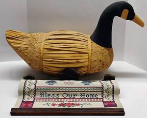 lot 86 image: Large vintage straw, cork, and wood duck decoy and Vintage Embroidered Wall Hanging