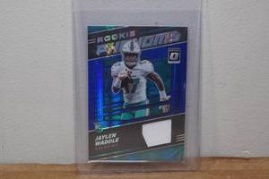 lot 87 image: 2021 Optic Jaylen Waddle Rookie Phenoms Insert Football Card