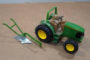 lot 263 image: Ertl John Deere Tractor with TSC Single Bottom Plow