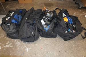 lot 1H image: Large Assortment of Youth Hockey Gear - Bags Included