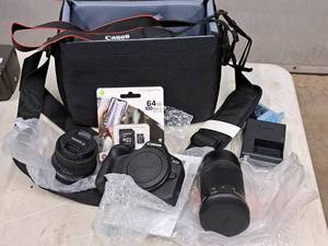 lot 811 image: Canon EOS Camera Kit - Camera Body, 55-210 Zoom Lens, 18-45 Lens, Memory Chip, Battery, Charger, Camera Bag