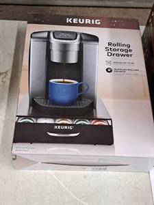 lot 824 image: Keurig Coffee Maker (in original packaging) with Rolling Storage Drawer 35-cup
