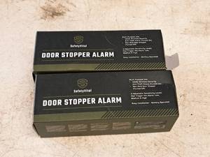 lot 938 image: Lot of (2) Safety Vital Door Stopper Alarms (in original packaging)
