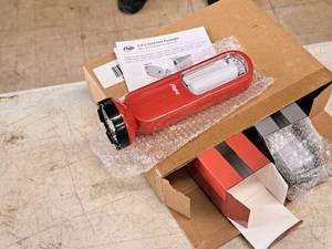 lot 943 image: Lot of (2) Flipo 2-In-1 Hand Held Flashlights - Multi-Use Flashlight & LED Array (in original packaging)