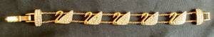 lot 90 image: Vintage Swarovski Swans 5 Panel Crystal Gold Bracelet