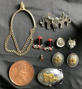 lot 135 image: Cowboy Accessories Collection of Belt Buckles, Earrings, Scarf Slides, Hair Clip, Boot Pin and Spur