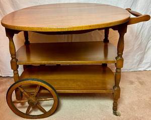 lot 151 image: Vintage Solid Maple Drop Leaf Tea Cart - One drawer on 2 Wooden Spoke Wheels with rubber tires and 2 castors